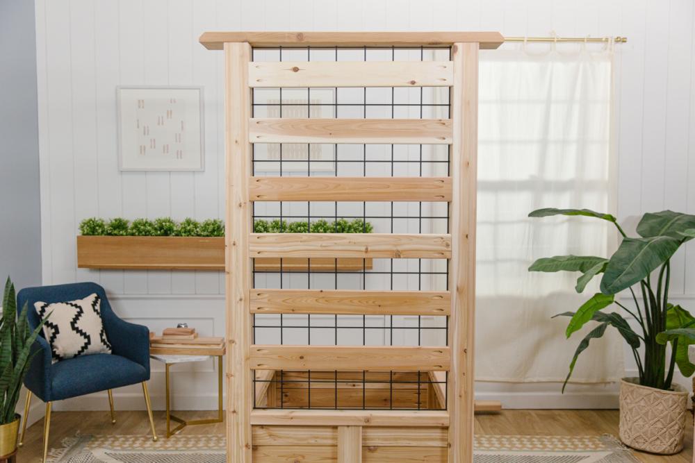 Privacy slats installed on the back of the trellis of the wooden DIY deck privacy screen.