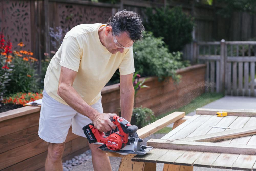 Cutting a cedar board for the new Z-frame with a circular saw.