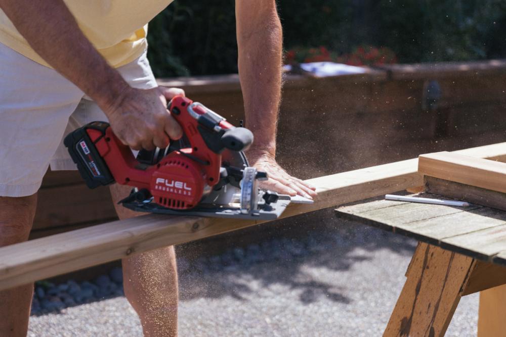 Cutting a cedar board for the new Z-frame with a circular saw.
