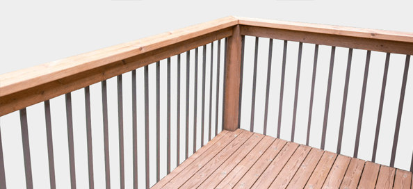 A corner of a deck with railing.