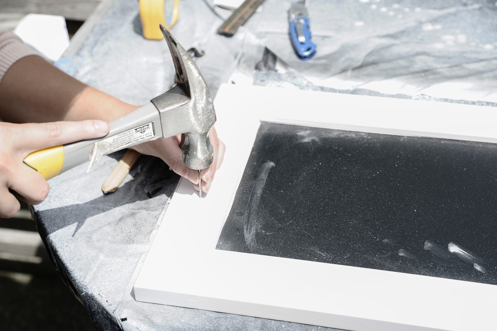 hammering chalkboard tray