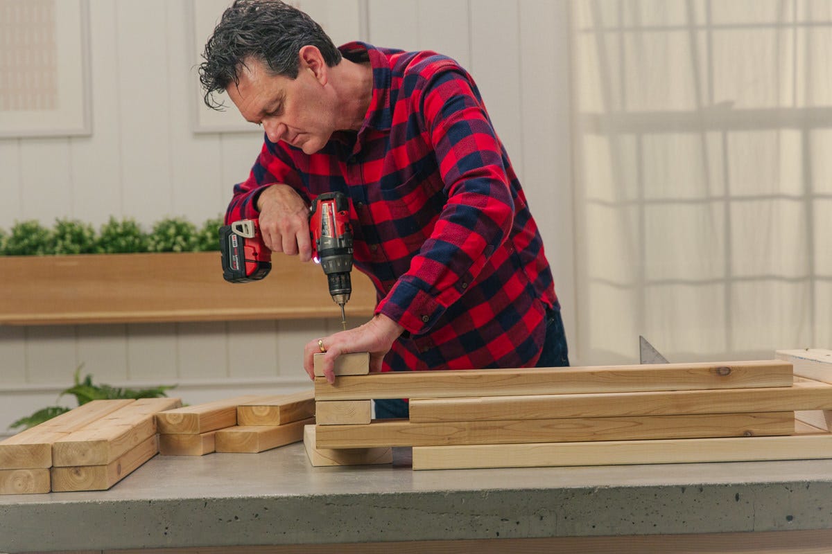 add layers to bench Driving screw to attach boards on top of each other at alternating right angles.