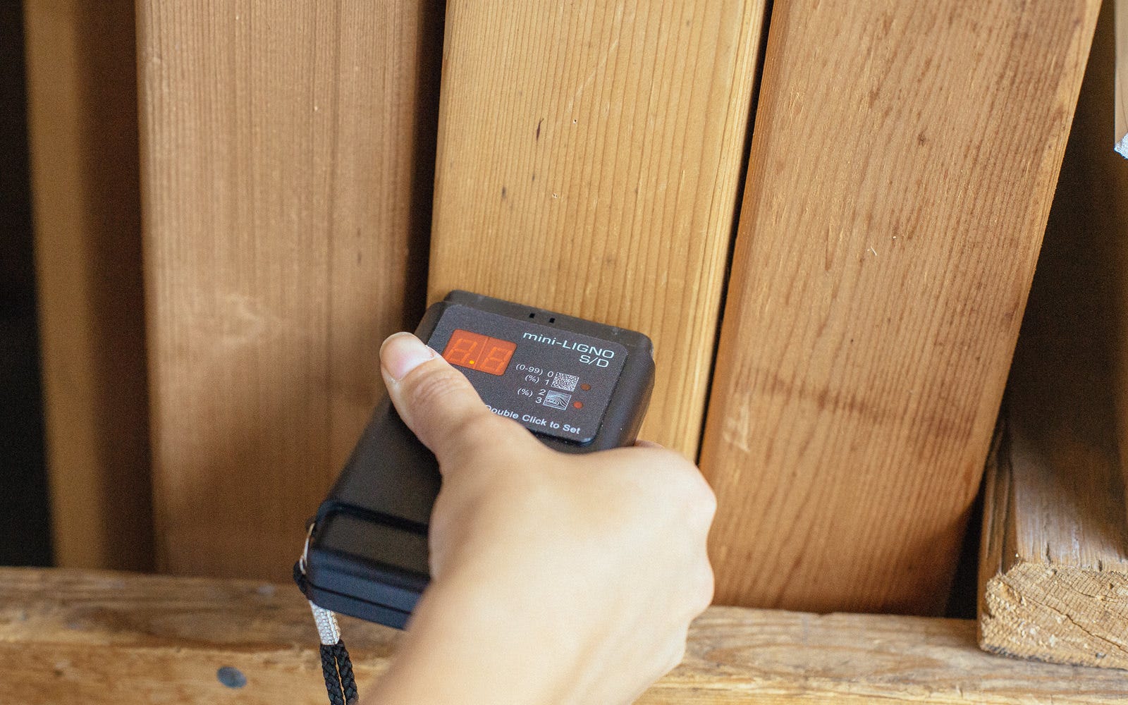 moisture meter on wood