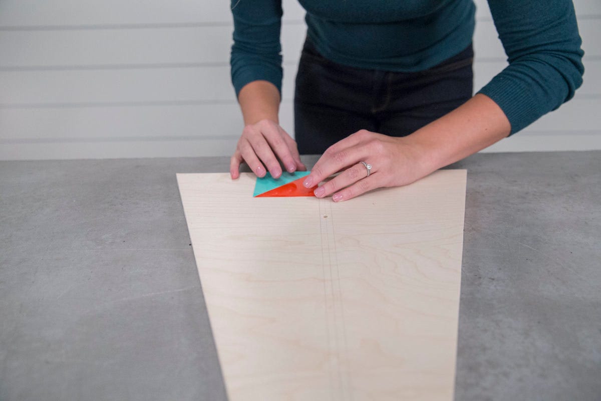 attaching geometric triangles to wooden christmas tree attaching geometric triangles to wooden christmas tree