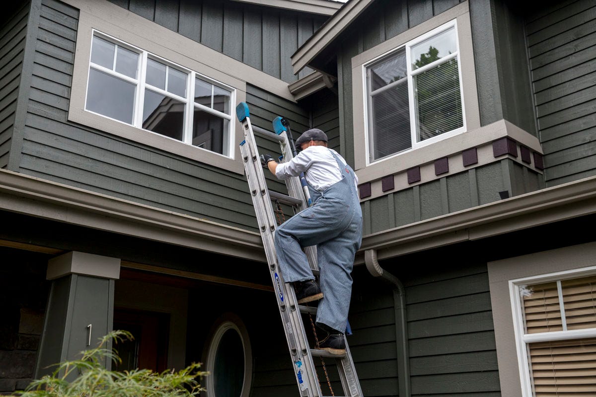 climbing ladder onto house climbing ladder onto house
