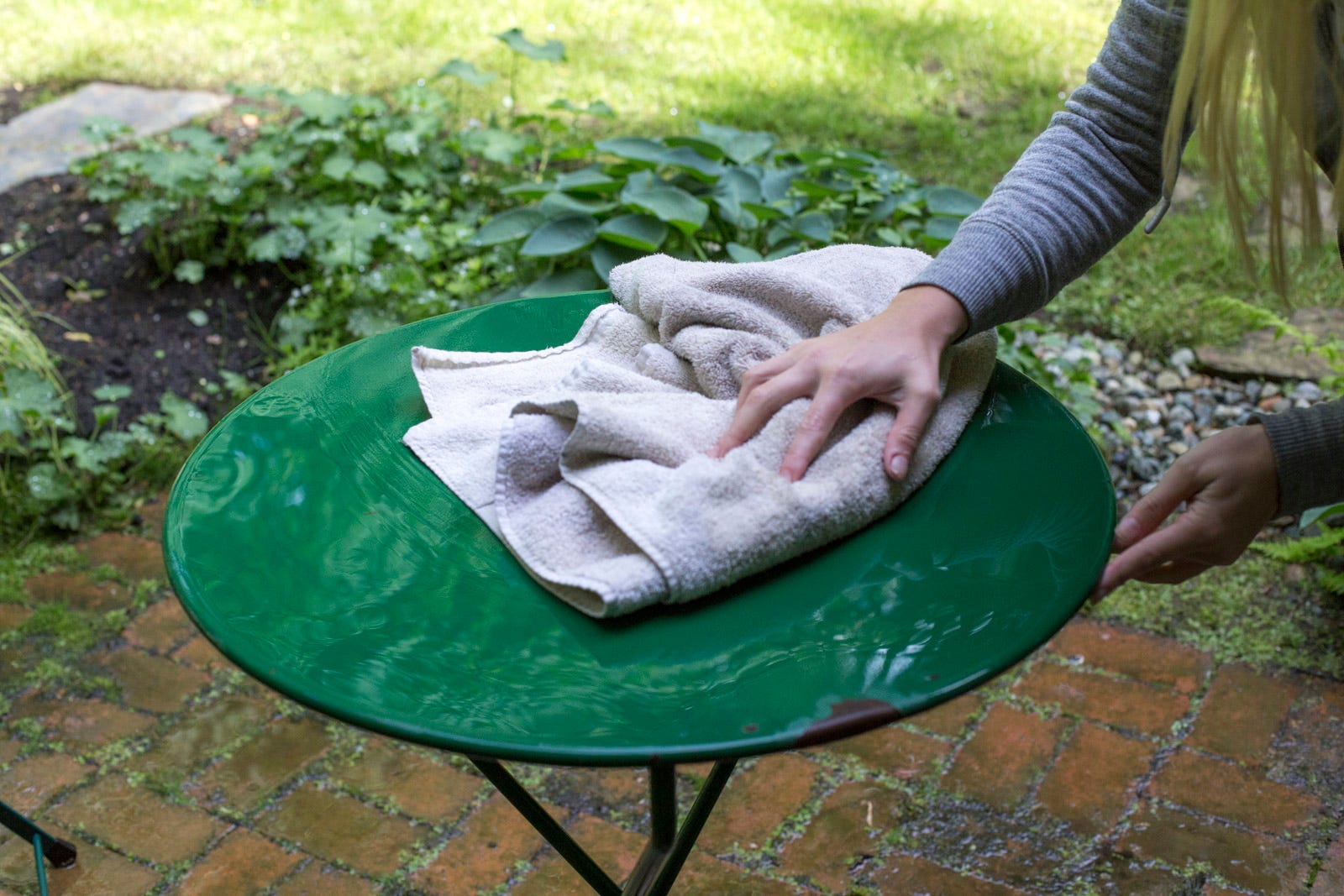 drying outdoor table with a towel drying outdoor table with a towel