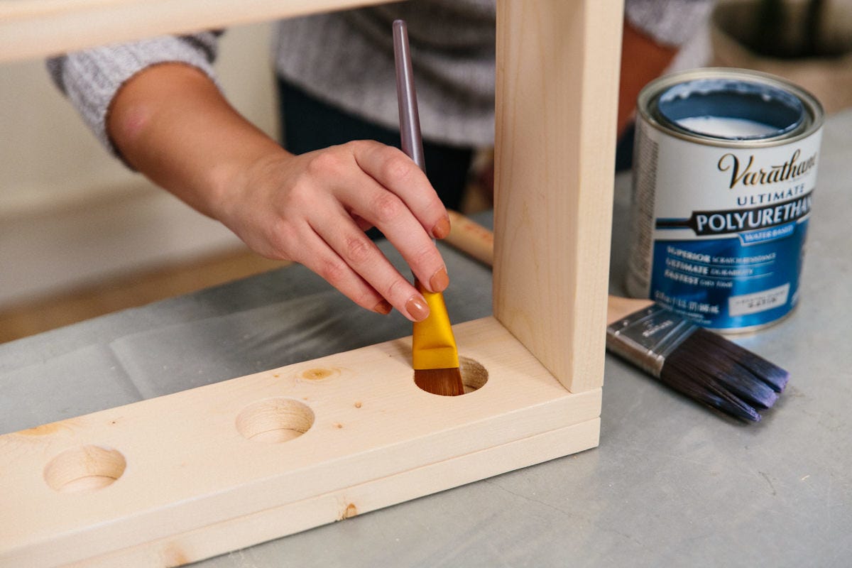 applying finish to the insides of the holes was much easier with a large artist’s paintbrush applying finish to the insides of the holes was much easier with a large artist’s paintbrush