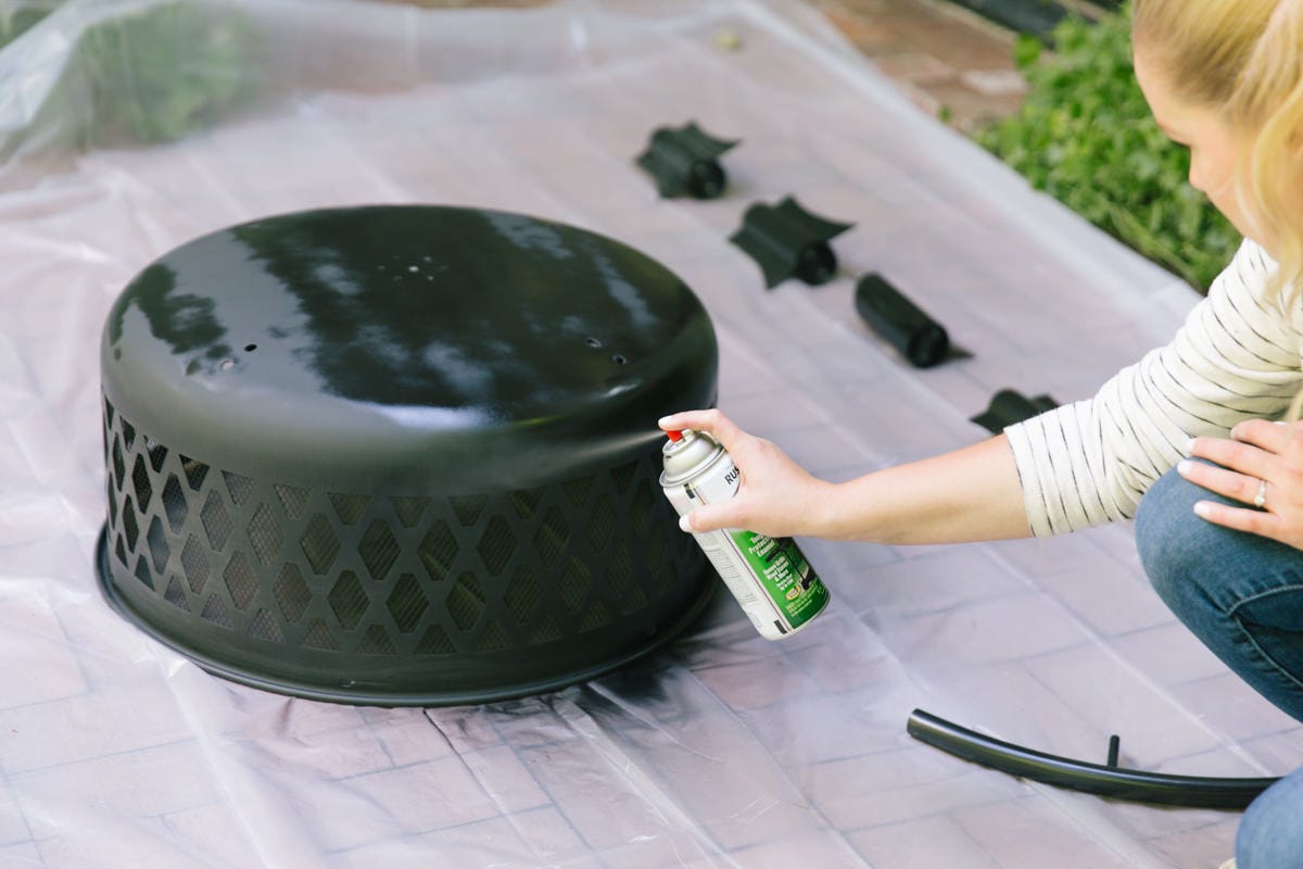 spray paint fire pit Spray painting fire pit.